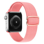 Pink nylon replacement strap for Apple Watch, comfortable, adjustable, stylish, compatible with multiple series.