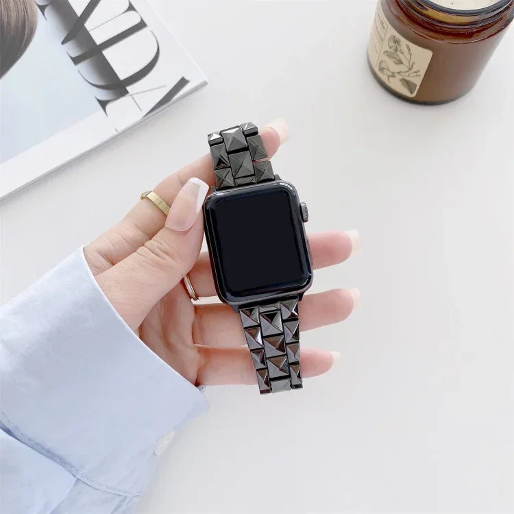 Ceramics replacement strap for Apple Watch showing rhombic grid design on wrist, compatible with multiple Apple Watch sizes.