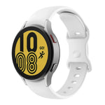 Butterfly buckle silicone watch band for Samsung Galaxy Watch4, displayed on a smartwatch with a yellow and black face.