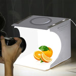 PULUZ แผงไฟ LED แบบวงแหวนขนาด 23 ซม. แบบพับได้ ชุดกล่องเต็นท์ถ่ายภาพพร้อมฉากหลัง 6 สี (ดำ, ขาว, เหลือง, แดง, เขียว, น้ำเงิน), ขนาดกางออก: 24 ซม. x 23 ซม. x 23 ซม., แผงไฟ LED แบบวงแหวน 23 ซม.