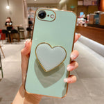 เคสโทรศัพท์ TPU พร้อมที่จับรูปหัวใจชุบอิเล็กโทรพลาติง สำหรับ iPhone 14 Pro Max, สำหรับ iPhone SE 2022 / 2020 / 7 / 8, สำหรับ iPhone 13 Pro Max, สำหรับ iPhone 13 Pro, สำหรับ iPhone 13, สำหรับ iPhone 13 mini, สำหรับ iPhone 12, สำหรับ iPhone 12 Pro Max