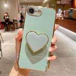 เคสโทรศัพท์ TPU พร้อมที่จับรูปหัวใจชุบอิเล็กโทรพลาติง สำหรับ iPhone 17e / 16e, สำหรับ iPhone 17 Pro Max, สำหรับ iPhone 17 Pro, สำหรับ iPhone 17, สำหรับ iPhone Air, สำหรับ iPhone 16 Pro Max, สำหรับ iPhone 16 Pro, สำหรับ iPhone 16 Plus