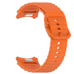 Wavy grain stitched silicone watch band in orange for Samsung Galaxy Watch 4, compatible with multiple sizes.