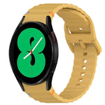 Wavy grain stitched silicone watch band for Samsung Galaxy Watch 4 in yellow color with quick release design.