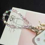 สายคล้องโทรศัพท์โบว์คริสตัลแฟนตาซีเรืองแสงแบบคู่ Ethereal Phantom สีชมพู น้ำเงิน
