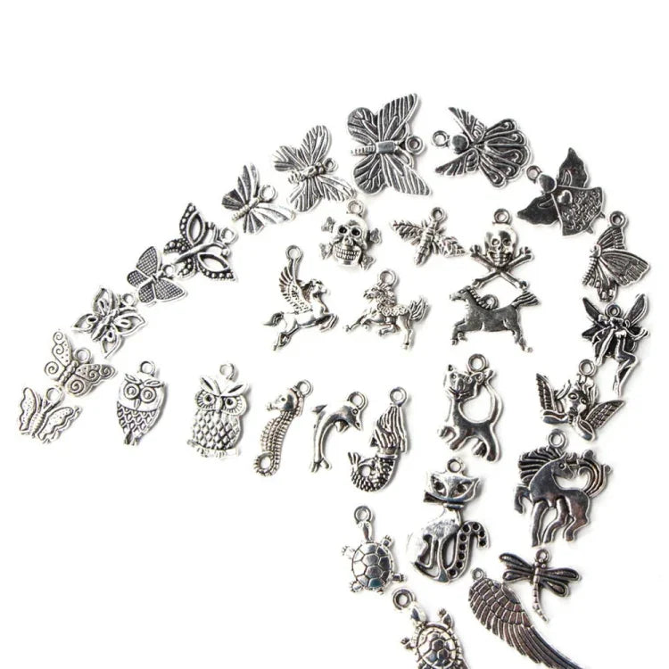 สร้อยข้อมือและจี้แฟชั่นสีเงินโบราณผสม 100 ชิ้น DIY เครื่องประดับยุโรปทำมือ